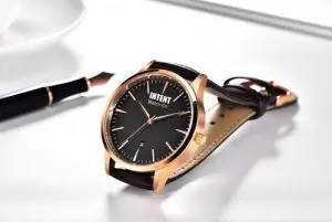 intent watch new logo rose gold brown on table